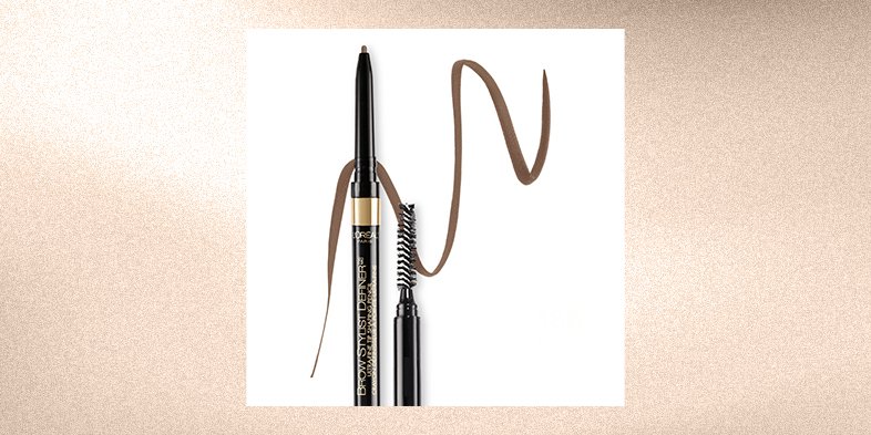 Close-up of a beauty product dropper dispensing eyebrow growth serum onto an applicator.